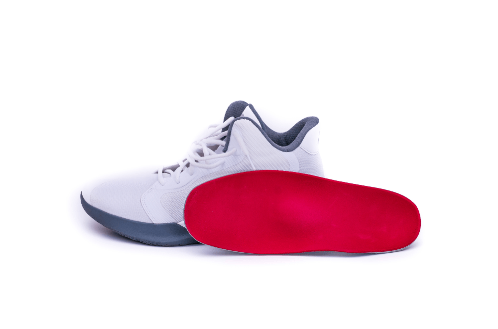white basketball shoes with red padding
