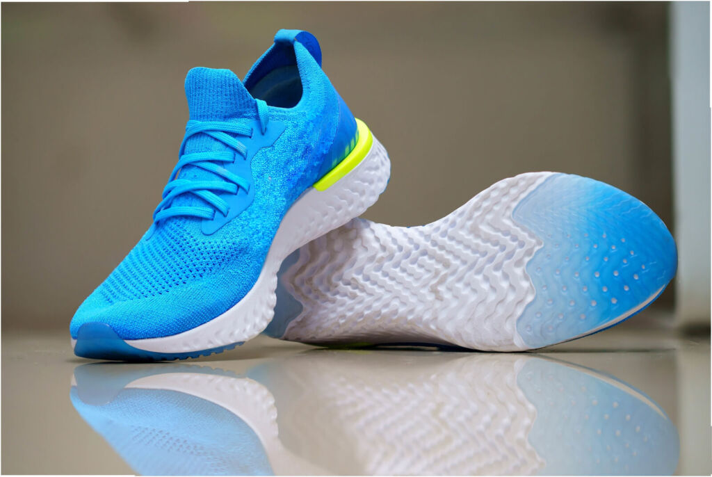 blue sport or running shoes for runner with reflection