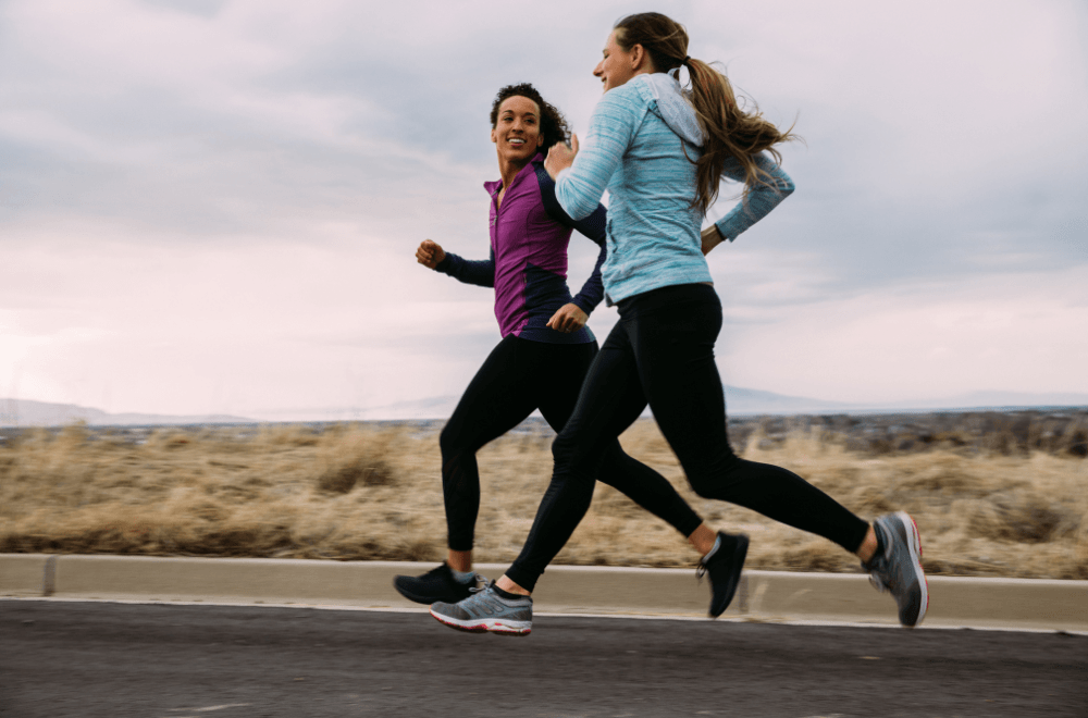 Two women running with spandex pants