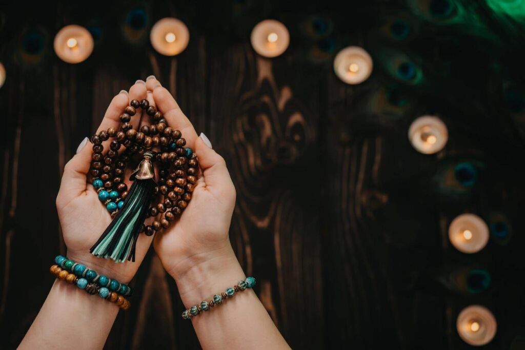 Woman holding yoga beads