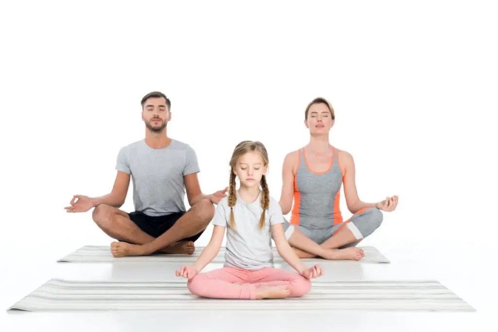 Family doing yoga together